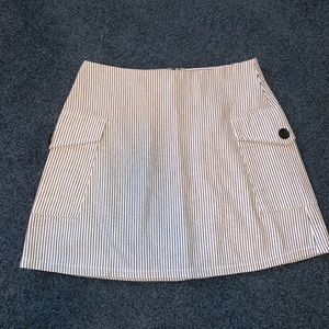 White skirt with black stripes and pockets
